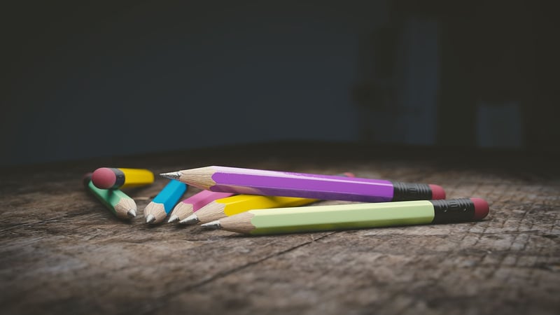 Hands writing a letter